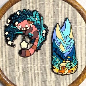 Two large art pins